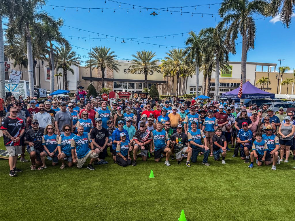 Participants competing at the SRQ Vets Annual Cornhole Fundraiser in Sarasota, raising funds to support local veteran programs and entrepreneur initiatives.